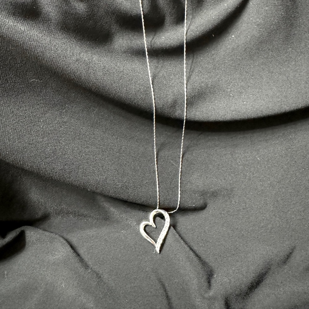Sterling silver heart pendant with cubic zirconia.